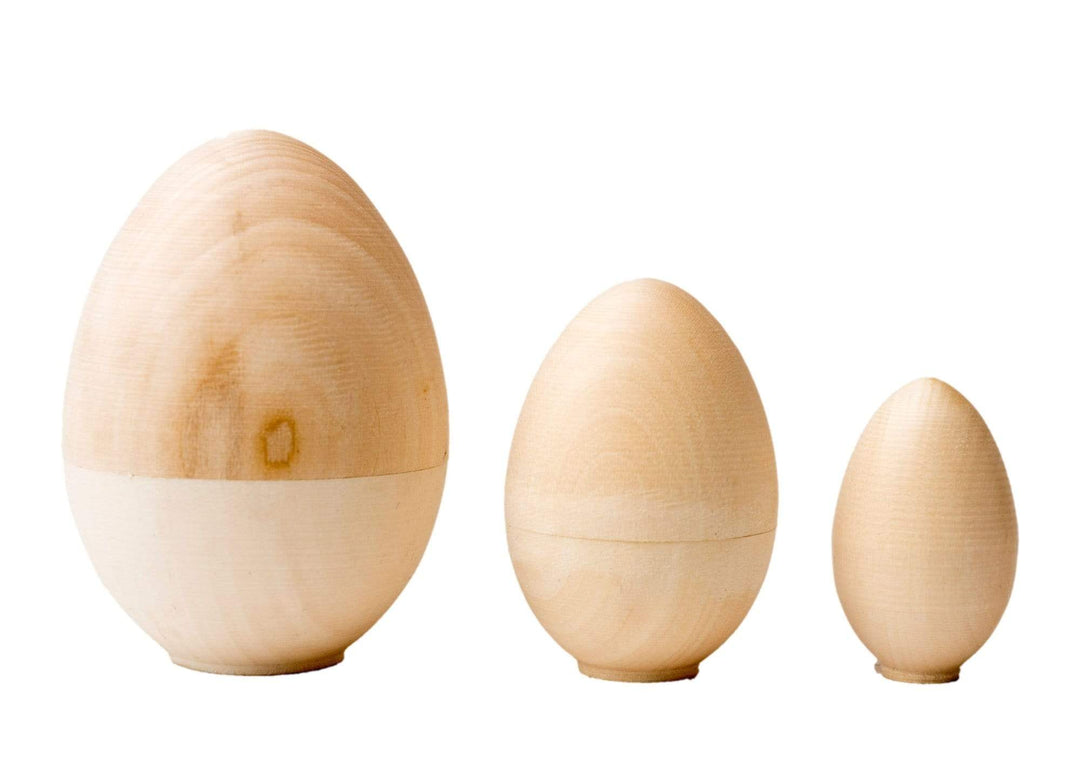 Three Blank Nesting Eggs of descending sizes.